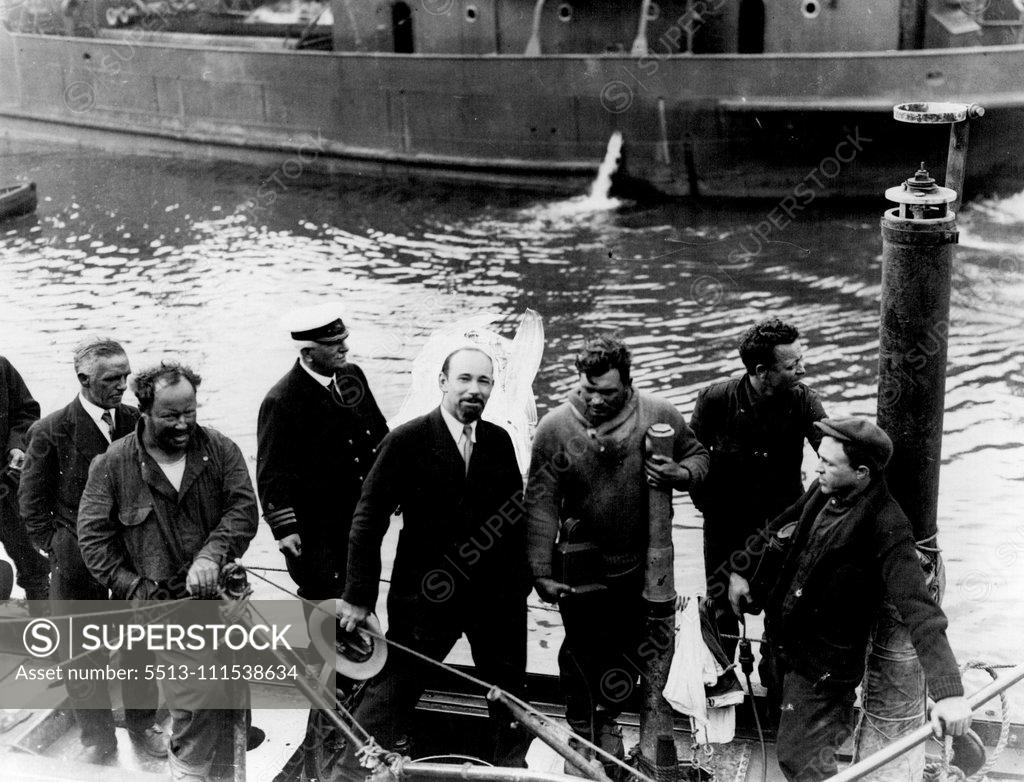 Stock Photo: 5513-111538634 'The Nautilus Arrives in Ireland': Sir Hubert Wilkins with members of his crew aboard showing the broken periscope and hand rail. The Nautilus in which Sir Hubert Wilkins hopes to reach the North Pole, arrived at Queenstown, Ireland yesterday. June 23, 1931. (Photo by Photopress).