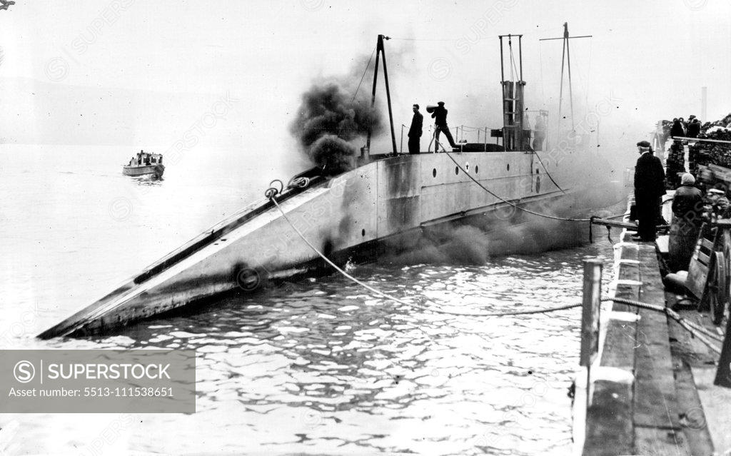 Stock Photo: 5513-111538651 Where There's Smoke - There's Not Always Fire: Despite appearances the Submarine Nautilus is not Ablaze. The smoke is coming from the engine from during one of the tests to which the Sir Hubert Wilkins and his men have been putting the craft in which they hope to reach the north pole. June 9, 1931. (Photo by International Newsreel Photo).