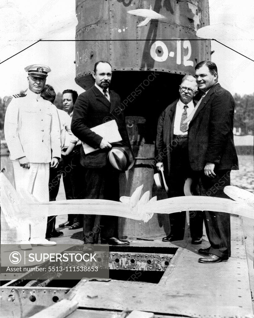 Stock Photo: 5513-111538653 Noted Explorer Inspects Submarine for Undersea Polar Cruise: Sir George Hubert Wilkins, famous polar explorer, with submarine experts inspecting the old submarine 0-12, which is being remodeled for the Wilkins North pole undersea expedition. The craft was leased from the United States government and is to be renamed the "Nautilus". According to present plans the submarine will be ready next summer when the expedition is scheduled to start out for the Northern ice fields. In the group are, Capt. 
