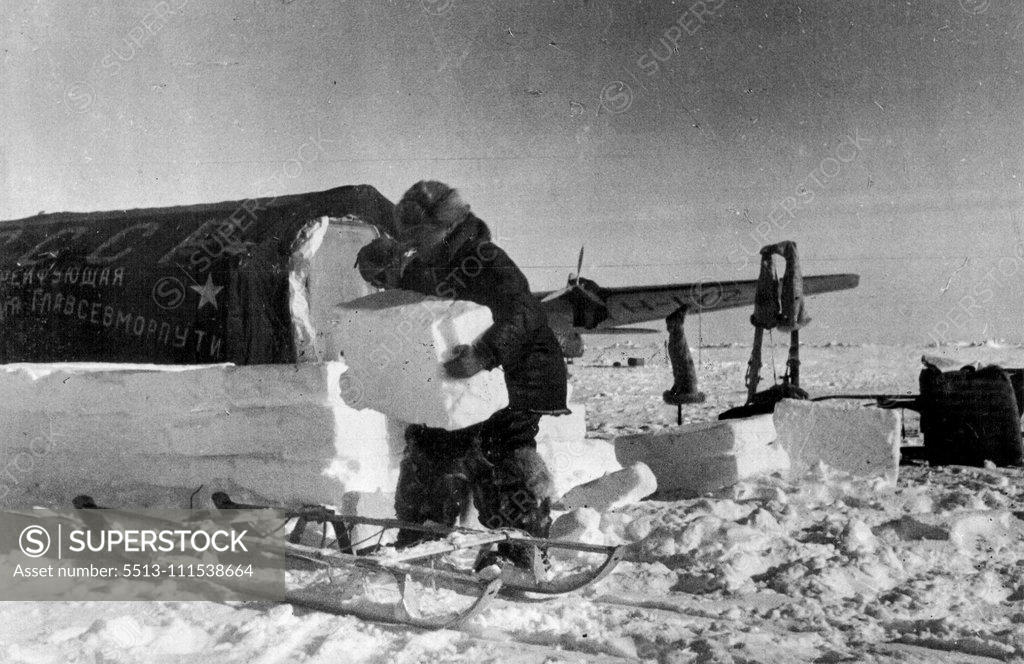 Stock Photo: 5513-111538664 The Soviet Station on the North Pole: Ivan Papanin, chief of the drifting station ***** North Pole, packing ice around ***** of the tents of the station. June 1, 1937. (Photo by Soyuzphoto).