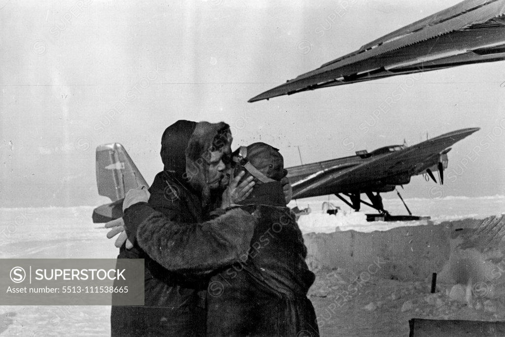 Stock Photo: 5513-111538665 The Soviet Expedition on the North Pole: Ernst Krenkel, wireless operator of the North Pole wintering party, taking leave of one of the members of the expedition, before the planes left the drifting ice-floe for the mainland. June 1, 1937. (Photo by Soyuzphoto).