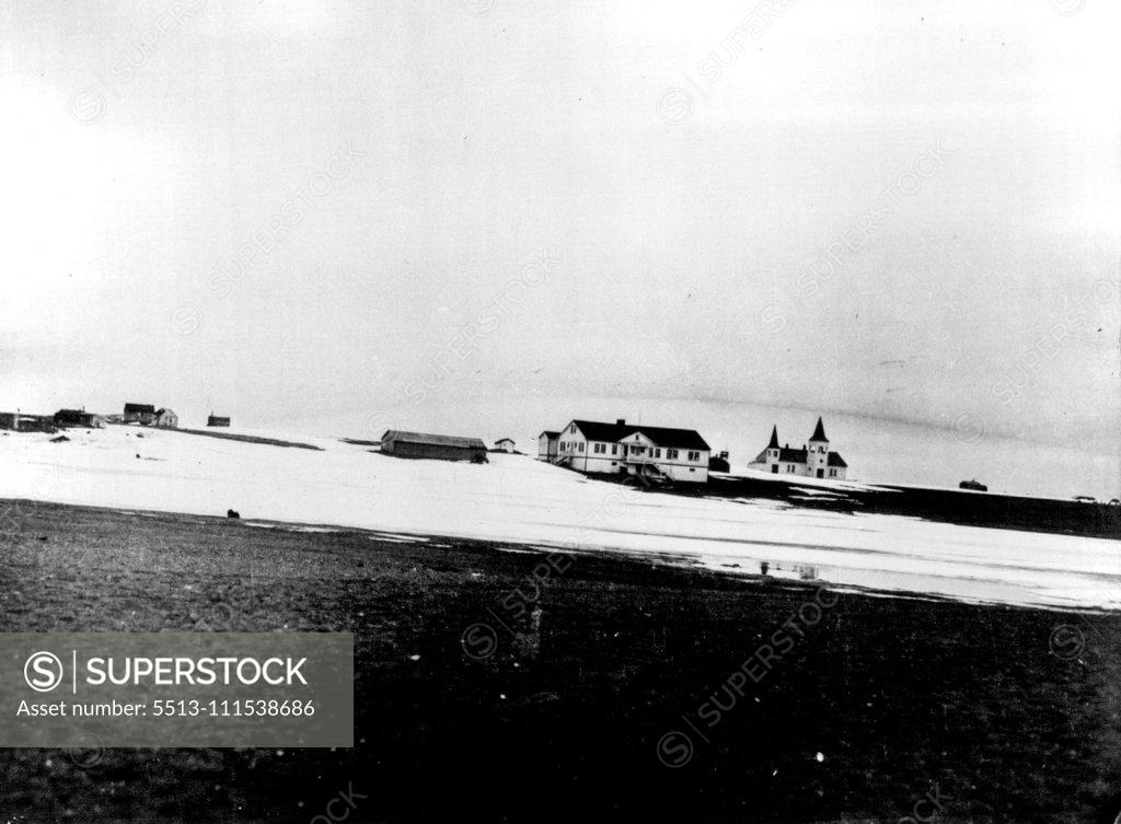 Stock Photo: 5513-111538686 First Pictures on Nielson Search: Land's End - This photo gives graphic idea of the bleakness of point barrow, Alaska, district, from which search for pilot Eielson and Mechanician Borland is conducted. In the background is the Presbyterian mission hospital and church at point barrow, farthermost point of land in Alaska. February 5, 1930. (Photo by International Newsreel Photo).