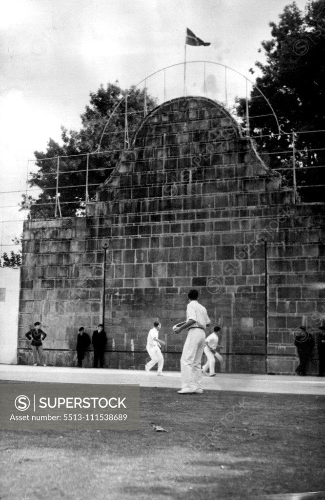Stock Photo: 5513-111538689 The ball has been thrown at the back wall, whence it rebounds at a great speed. One man must always stay at the back of the court. July 28, 1947.