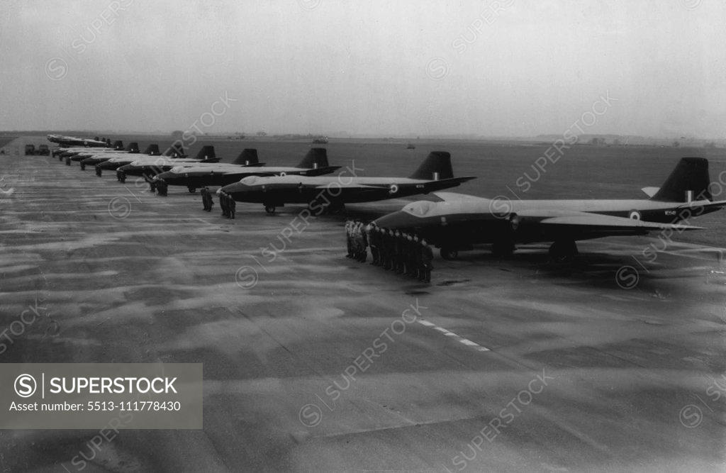 Stock Photo: 5513-111778430 Britain's Jet Bomber Squadron Goes On Parade -- An impressive picture showing a line-up of Canberra jet. bombers which make up No 101 Squadron-Britain's first jet bomber squadron. With them at Binbrook in process of converting to Canberra's is 617 Squadron, the R.A.F's famous dam buster unit. The twin-jet Canberra -it has a crew of three-pilot, navigator-plotter and observer-is the most expensive airplane so far in service with the Royal Air Force. Before 101 Squadron, was equipped with these p