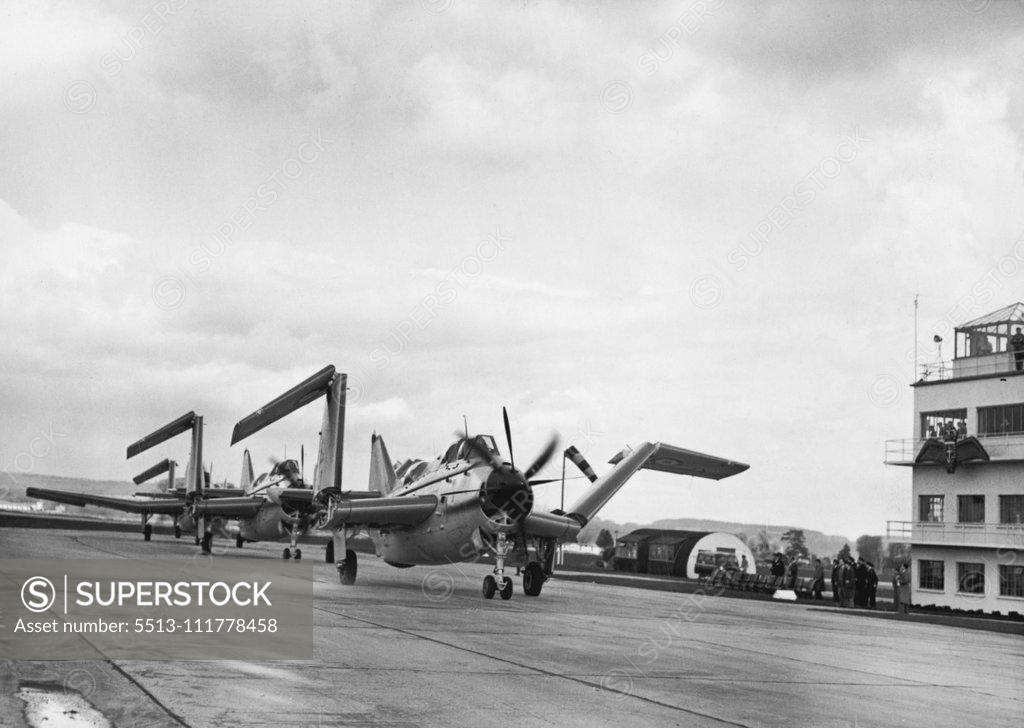 Stock Photo: 5513-111778458 Inauguration Service For Navy's First Flight Of Gannet Aircraft. The Fairey Gannets seen, upon landing after the Fly Past during today's "Hand Over" Ceremony, collapsing their wings as they taxi past the saluting base at the R.N, Air Station at Ford (Sussex). The Royal Navy's first unit of Fairey Gannet anti-submarine aircraft was formally inaugurated at the R.N. Air Station at Ford, Sussex today. The Garnet, a super-priority plane, is the first aircraft to be designed solely for anti-submarine 