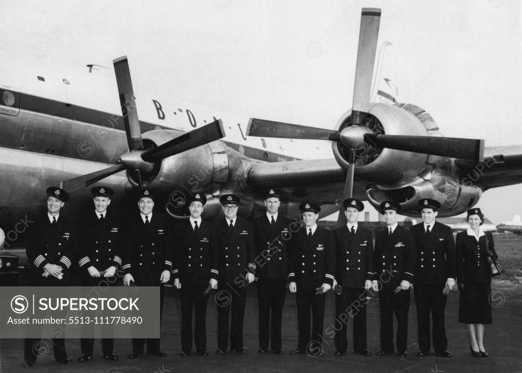 Stock Photo: 5513-111778490 Air Crew to Fly Queen on Her Commonwealth Tour. The B.O.A.C. crew to fly Her Majesty the Queen on the first stage of her tour. They will take the Queen to Bermuda. Left to Right. Captain Anthony Christopher Loraine; Capt: Richard Alastair Callander, First Officer John Eric Willett; Navigation Officer John Douglas Elliott; Radio Officer Charles Harry Phillips; Engineer Officer Eric Oswald Draper; Engineer Officer Ralph Skepelhorn, Steward Raymond Lewis Dunkley; Steward John Jarvis; Steward Michae