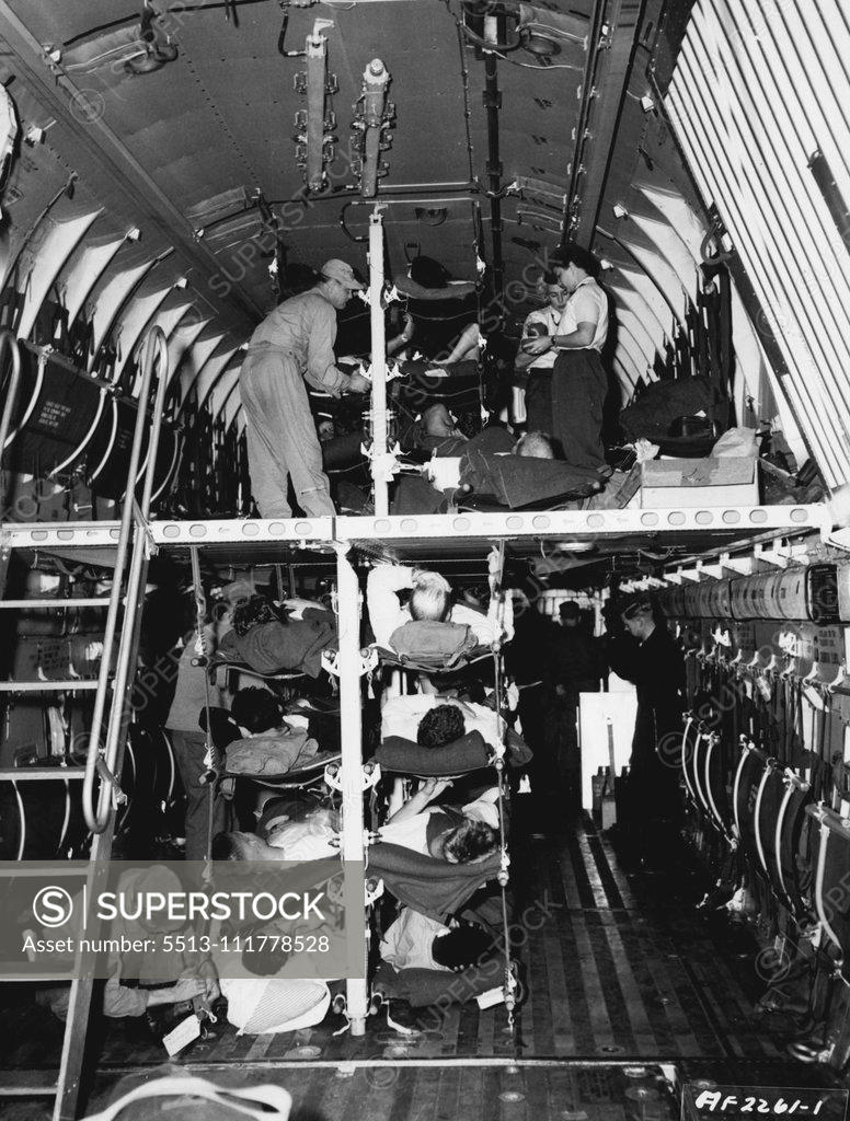Stock Photo: 5513-111778528 Double Deck Hospital Airplane Instead of having to wait at an airstrip in Korea for evacuation on smaller aircraft, nearly 100 Patients are loaded into a giant C-124 of the 374th Troop Carrier Wing/(Combat Cargo) and brought to Japan for further treatment at hospitals here. Because of its larger capacity, this U. S. Air Force Globemaster can bring back more men quicker, and get them started on the road to recovery faster. The spacious double-deck interior of the plane can carry as many patients