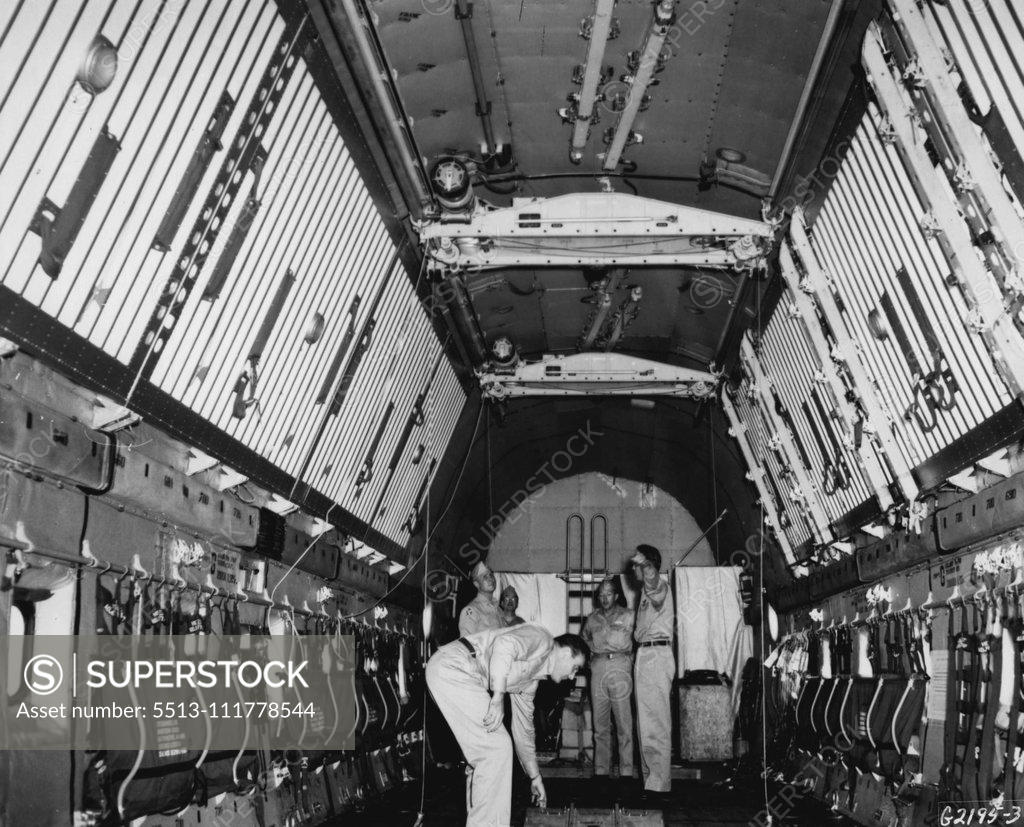 Stock Photo: 5513-111778544 Roomy Interior The cavernous cargo hold of a U. S. Air Force C-124 "Globemaster II" demonstrates the vast cargo- carrying potential of the giant transport. Being tested under field conditions, and flying with other transports engaged in the Korean airlift by the Far East Air Forces 315th Air Division (Combat Cargo), the Globemaster will carry approximately 30 tons of cargo on a single flight in the Korean airlift, more than three times the amount carried by the C-54 Skyraaster, previously the la