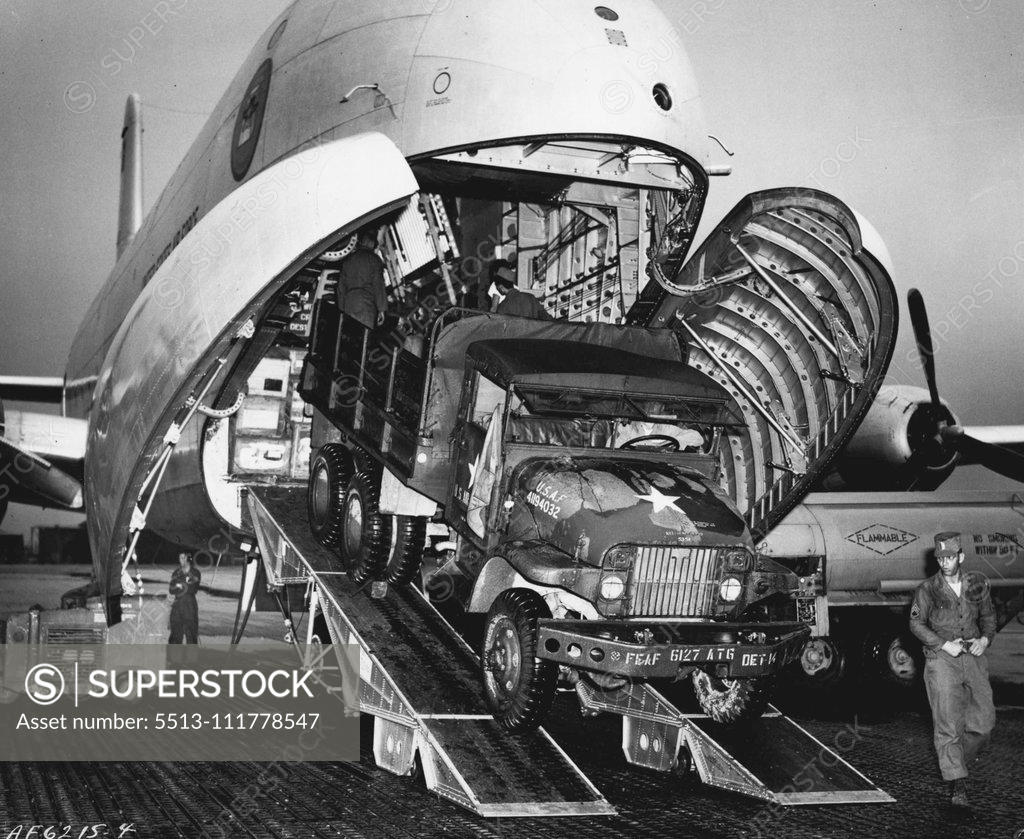 Stock Photo: 5513-111778547 Pakistan Bound Globemaster Loaded in Korea A. U.S. Air Force truck is loaded on a C-124 Globemaster at an Air Force installation in Korea for airlift to the flood-stricken area of East Pakistan. In the joint Air Force-Army mercy mission, 40 members of the U.S. Army 37th Medical Preventative Medicine Company and nearly 30 tons of medical supplies left Seoul, Korea aboard two Globemasters. Six other C-124s are also taking part in the mercy airlift. August 17, 1954. (Photo by U.S. Air Force Photo).