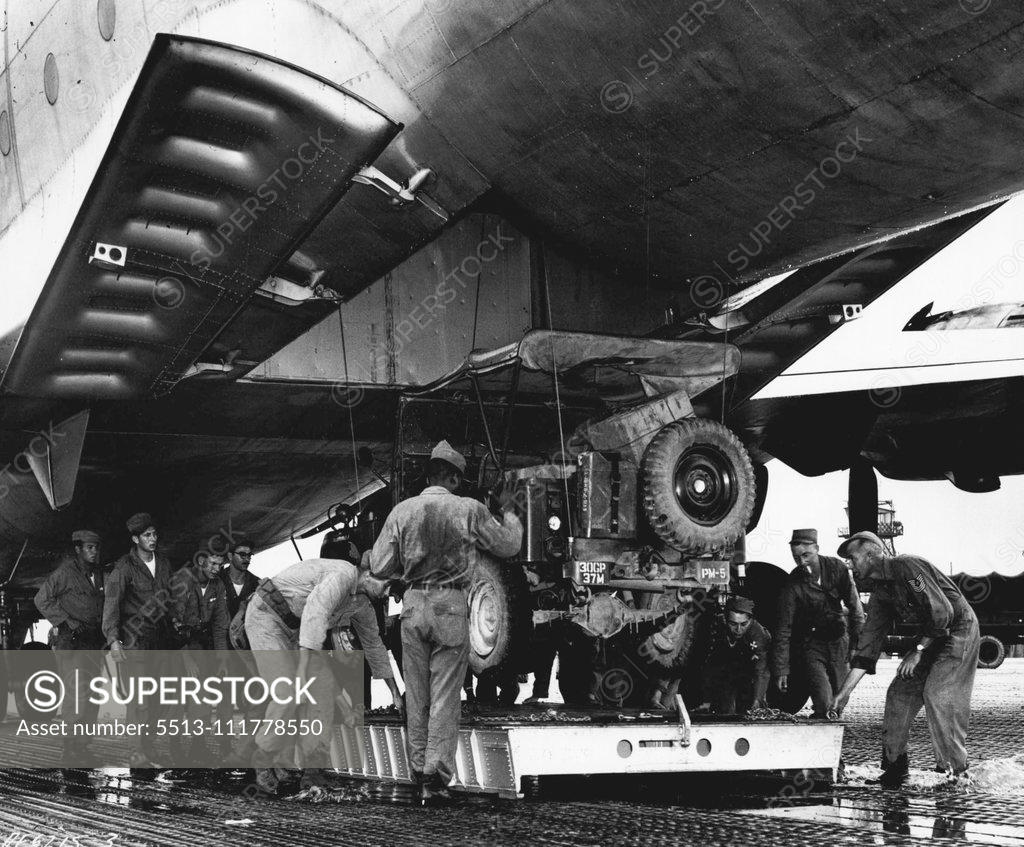 Stock Photo: 5513-111778550 United States Mercy Mission To East Pakistan Loaded In Korea U. S. Air Force end Army personnel load a jeep aboard one of eight C-124 Globemasters which left recently with United States aid to flood-stricken East Pakistan. In the joint Air Force-Army mission, 40 members of the Army's 37th Medical Preventative Medicine Company and tons of medical supplies and equipment are being airlifted to the flood victims. The Globemaster crews include extra pilots, who will alternate at the controls in order