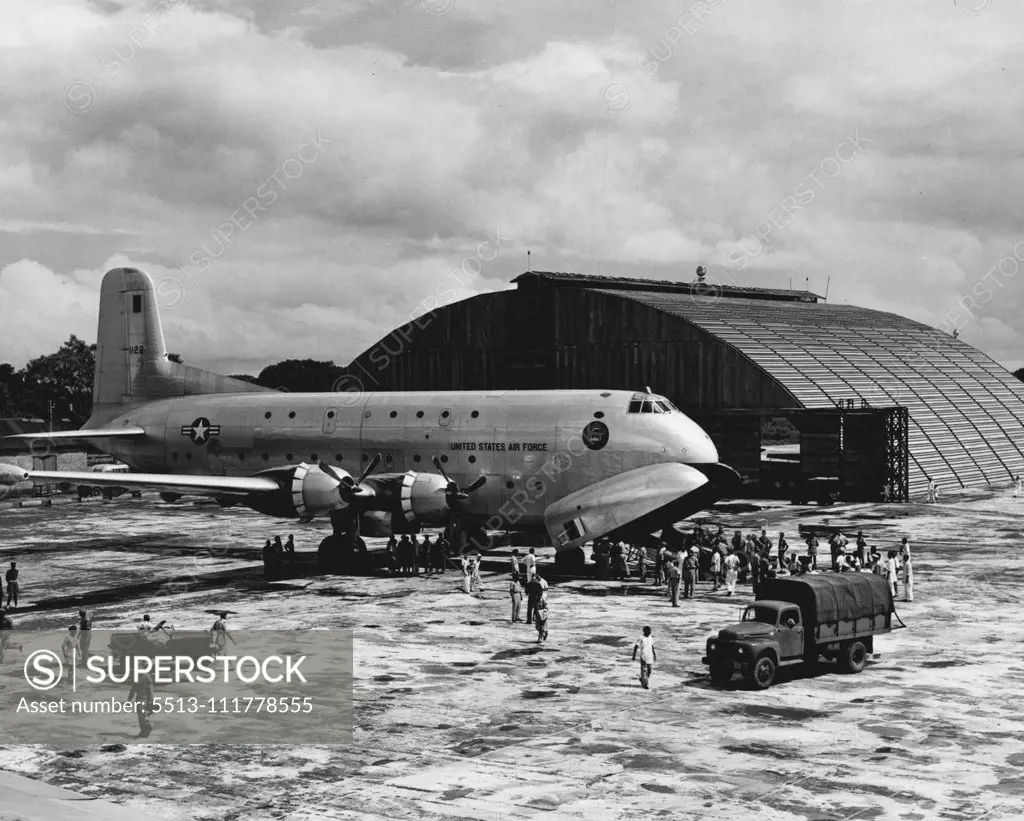 Cargo-Carrying U. S. Air Force C-124 Is Unloaded In Flood-Stricken Dacca The second U. S. Air Force C-124 Globemaster to arrive in the flood-stricken area of East Pakistan, is unloaded at the airfield in Dacca. Eight C-124s of FEAF's 315th Air Division are airlifting personnel of the U. S. Army 37th Radical Preventive Medicine Company and tons of medical supplies and equipment to the flood- ravaged area of East Pakistan. The crews of the aircraft include extra pilots,who are alternating at the c