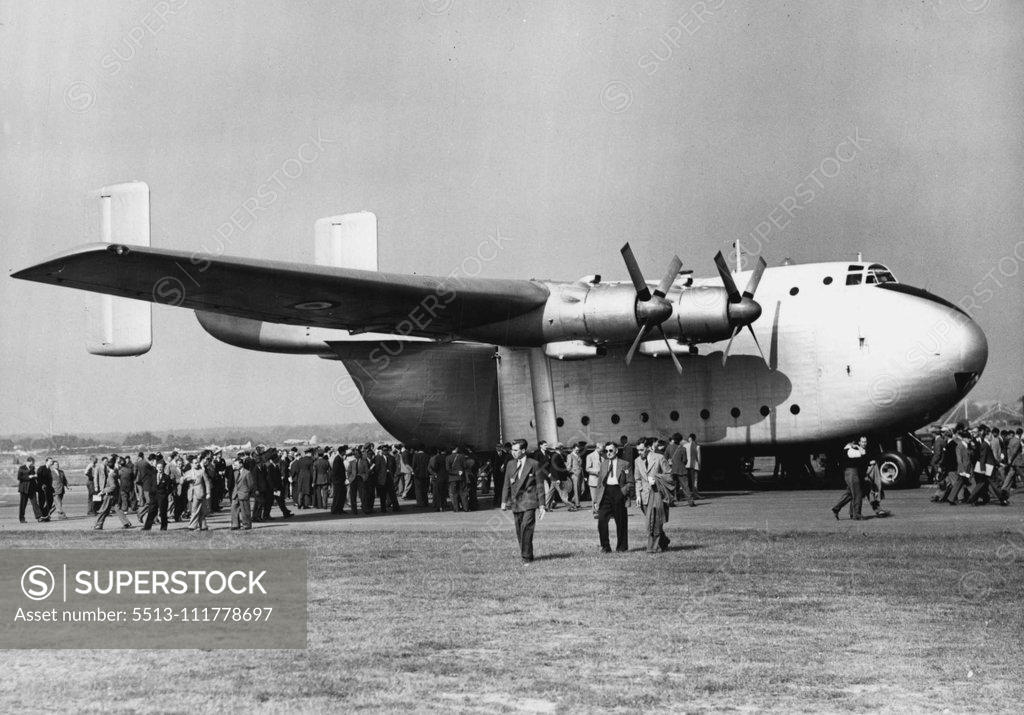 Stock Photo: 5513-111778697 Flying Display And Exhibition Opens At Farnborough -- One of the "giants of the air" on show at Farnborough today - the Blackburn and General Aircrafts, Ltd. Prototype Beverley a freighter, in which interest is obvious by the crowds queuing to inspect it. Large crowds today attended the opening of the 1953 Flying Display and Exhibition, a "Shop window" for the products of the members of the Society of British Aircraft Constructors, at Farnborough Aerodrome, Hants. September 07, 1953. (Photo by F