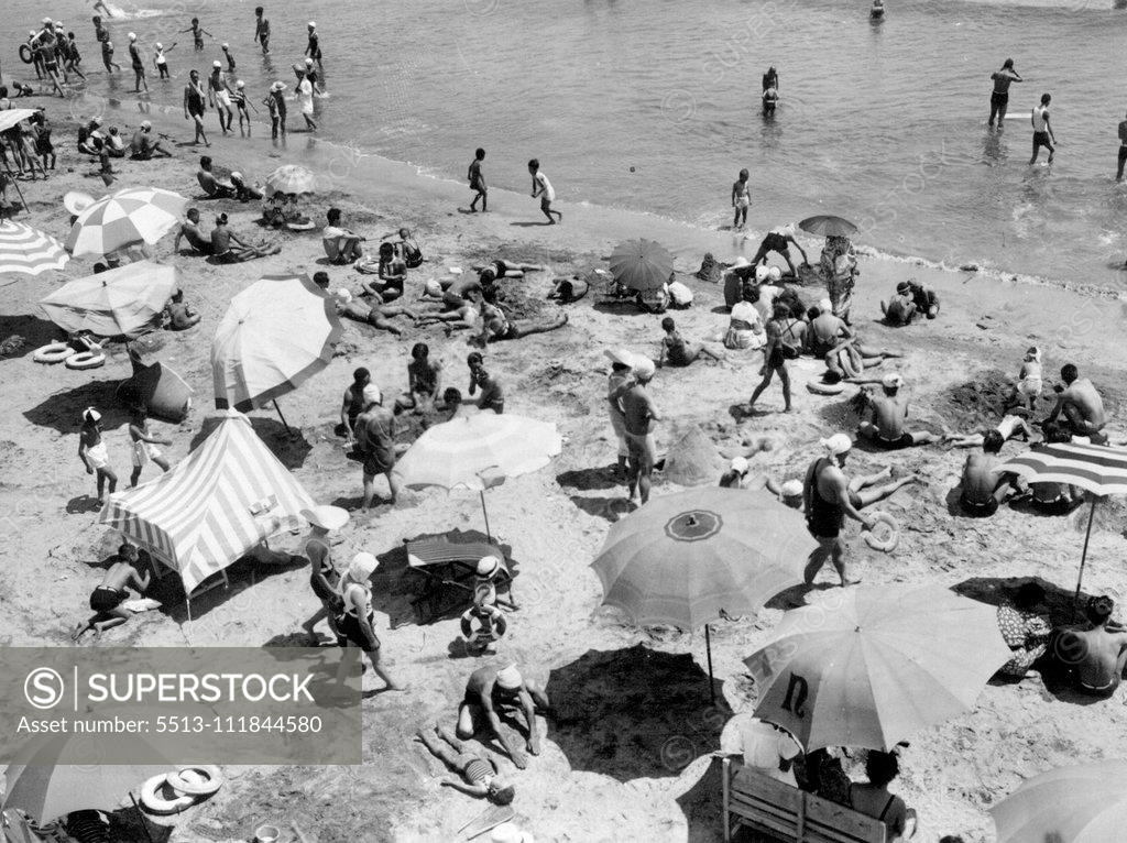 Stock Photo: 5513-111844580 Almost any Seaside Scene in Summer.. A refreshing breeze swept Tokyo during a most of today, but in between puffs the sun was pretty hot, and countless folks were glad to get away to near by beaches. This scene was at Kamalaura. July 24, 1938. (Photo by The Domei Newsphoto Service).;Almost any Seaside Scene in Summer.. A refreshing breeze swept Tokyo during a most of today, but in between puffs the sun was pretty hot, and countless folks were glad to get away to near by beaches. This scene was a