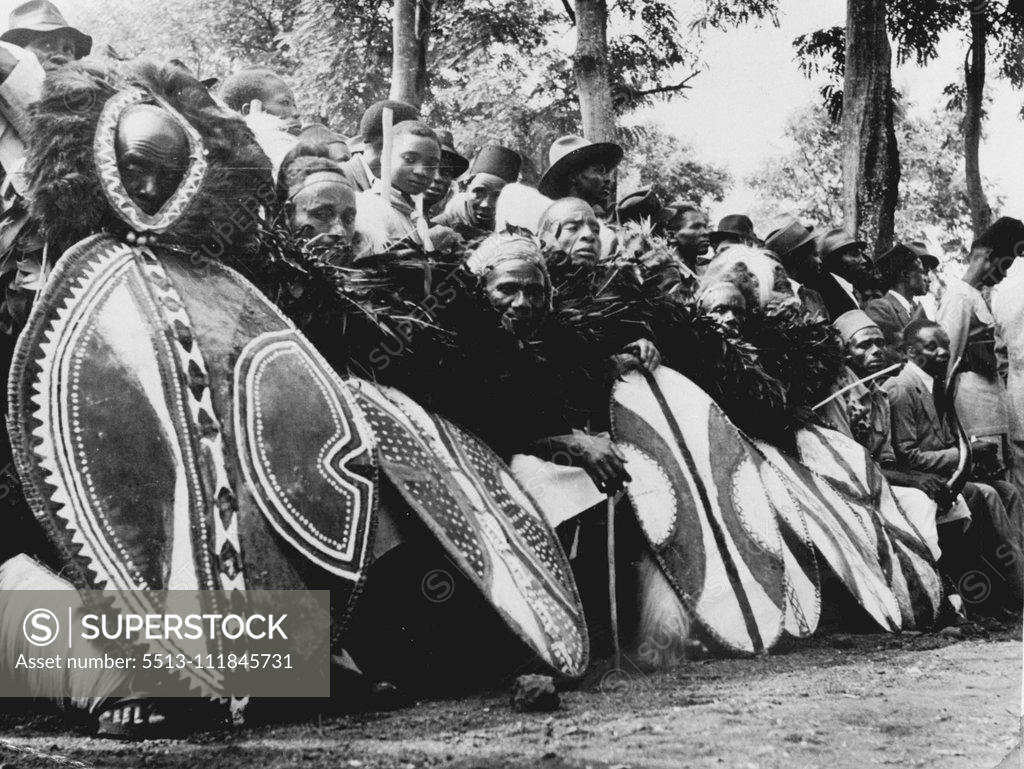 Stock Photo: 5513-111845731 Cambridge-Trained African Chief -- Chief Thomas Marealle of the Chagga Tribe: Chagga singers in traditional dress wait to perform their part in the ceremony. January 28, 1955. (Photo by Central Office of Information Photograph).;Cambridge-Trained African Chief -- Chief Thomas Marealle of the Chagga Tribe : Chagga singers in traditional dress wait to perform their part in the ceremony.