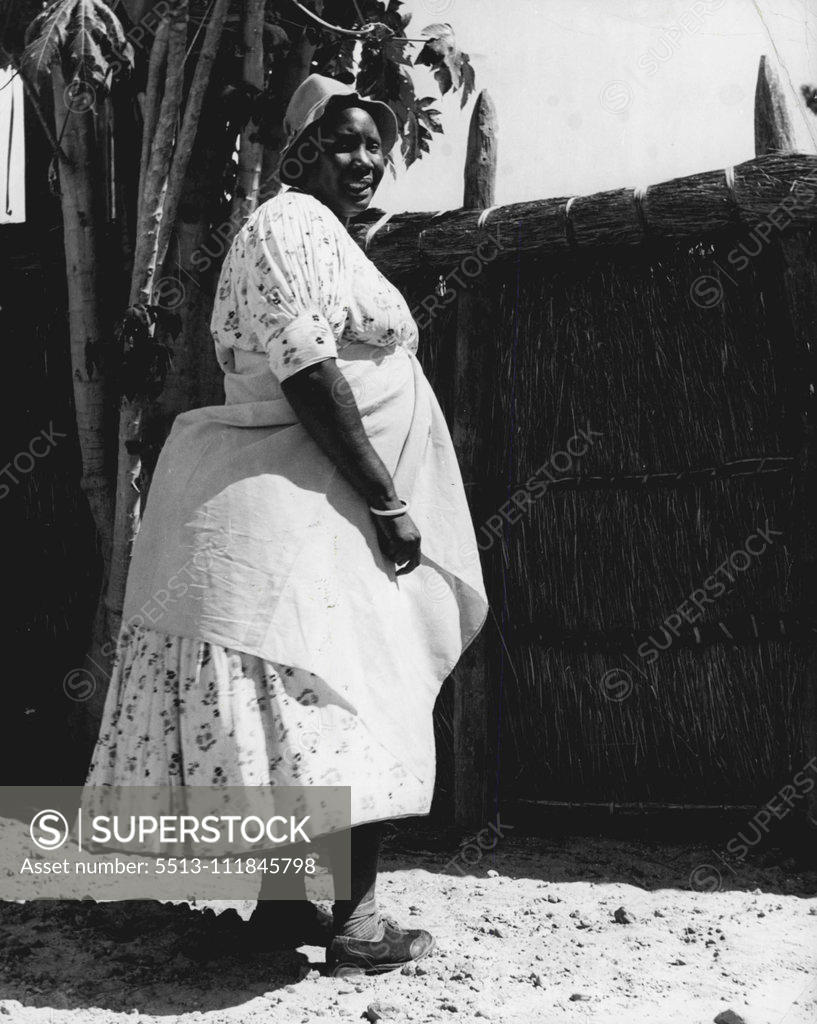 Stock Photo: 5513-111845798 Barotse Women -- Leader of the Barotse women's fashions is the Chief's premier wife, called the 'Moyo' which means the Soul of the Nation. This photograph shows the 'Moyo' in a dress which gained world-wide popularity in the later part of the nineteenth century. It is the custom for the Chief to have wives from neighbouring tribes. The present ruler has twenty-five wives. June 23, 1952. (Photo by Nigel Watt, Camera Press).;Barotse Women -- Leader of the Barotse women's fashions is the Chief's pr