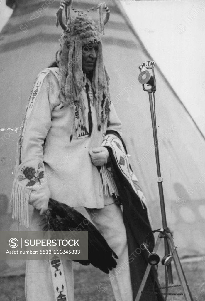 Stock Photo: 5513-111845833 Indian Chief at the Mike During Visit of King and Queen to Canadian West. An interesting picture just received shows an Indian Chief Percy Littledog at the microphone during the broadcast of the event when the King and Queen visits Calgary, Alberta heart of the Canadian West. July 24, 1939.;Indian Chief at the Mike During Visit of King and Queen to Canadian West. An interesting picture just received shows an Indian Chief Percy Littledog at the microphone during the broadcast of the event when th