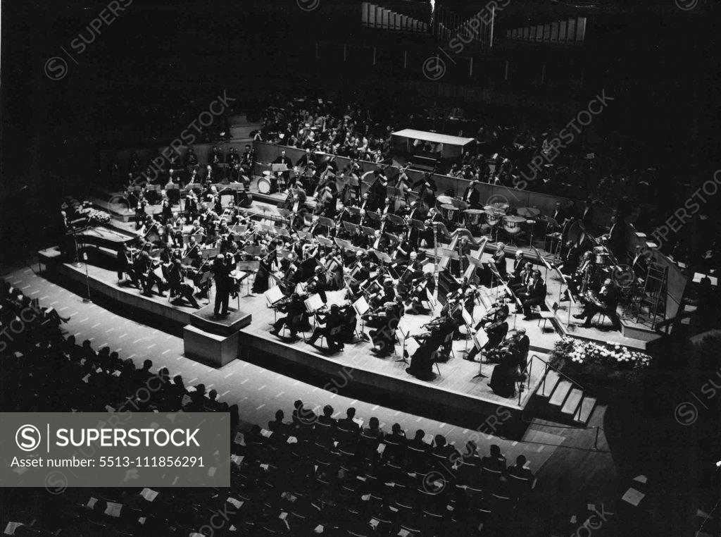 Stock Photo: 5513-111856291 ***** Symphony Concerts From The Royal Festival Hall : Winter Season. ***** Eugene Goossens conducting the BBC Symphony Orchestra and the BBC Show Band in the first performance in this country of Rolf Liebermann's Concerto for Jazz Band and Symphony Orchestra, on 26th October 1955. The concert was broadcast in the BBC Home Service. October 26, 1955.;***** Symphony Concerts From The Royal Festival Hall : Winter Season. ***** Eugene Goossens conducting the BBC Symphony Orchestra and the BBC Show B