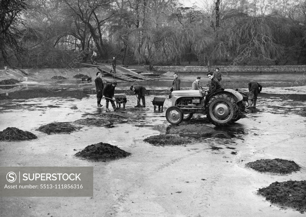 Stock Photo: 5513-111856316 Lake Spring Cleaning For The Coronation - Men at work with tractor, getting the sludge away in the St. Jamees Park lake. The lake in St, James's Park is now undergoing its periodical "Spring" clean. It will take about a month to drain the lakes clear away the sludge, and make any repairs which may be necessary to the concrete bed. The lake was last cleaned in 1-950 and it has been started earlier on this occasion to ensure that it shall be completed in good time for the coronation. January 03, 1