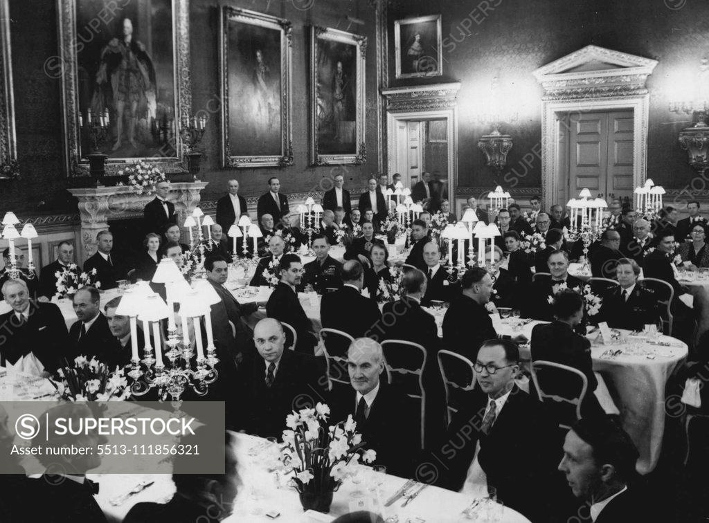 Stock Photo: 5513-111856321 P.M. Gives Dinner For Soviet Delegates - A general view of the dinner. At the top table left to right are: The Earl of Halifax, The Rt. Hon. The Speaker, (Clifton Brown), Monsieur A.A. Fadew, Mrs. Attles, Monsieur V.V. Kuznetson, Mr. Attlee, the Soviet Charge d'Affaires, the Archbishop of Canterbury, Monsieur M.A. Suslov, Mr. Arthur Greenwood and Monsieur V.J. Latsis. Mr. C.R. Attlee, the Prime Minister gave a dinner last night at St. James's Palace, London, in honour of the delegates from the S