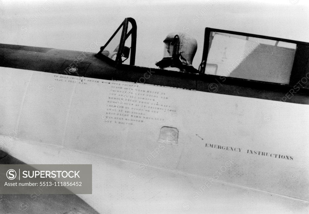 Stock Photo: 5513-111856452 Record High Altitude Flight. Our photographer shows Flight-Lieutenant M. J. Adam in the sealed suit ready in his machine to start on a flight. July 20, 1937. ;Record High Altitude Flight. Our photographer shows Flight-Lieutenant M. J. Adam in the sealed suit ready in his machine to start on a flight.