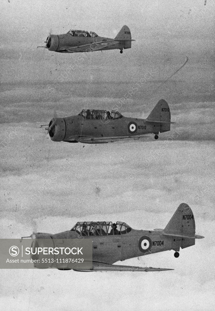 Stock Photo: 5513-111876429 A Yank In The ***** -- Fly ***** School at Grantham in flight in the "Harvard" training ***** aircraft recently arrived from the USA. It is announced ***** 400 machines of this type have been ordered follow ***** the recent visit of the Air Mission. They have a ***** speed of 190 mph at 11,000 ft. and are up-to-date ***** respects. March 6, 1939. (Photo by Central Press Photos Ltd.).;A Yank In The ***** -- Fly ***** School at Grantham in flight in the "Harvard" training ***** aircraft recently a
