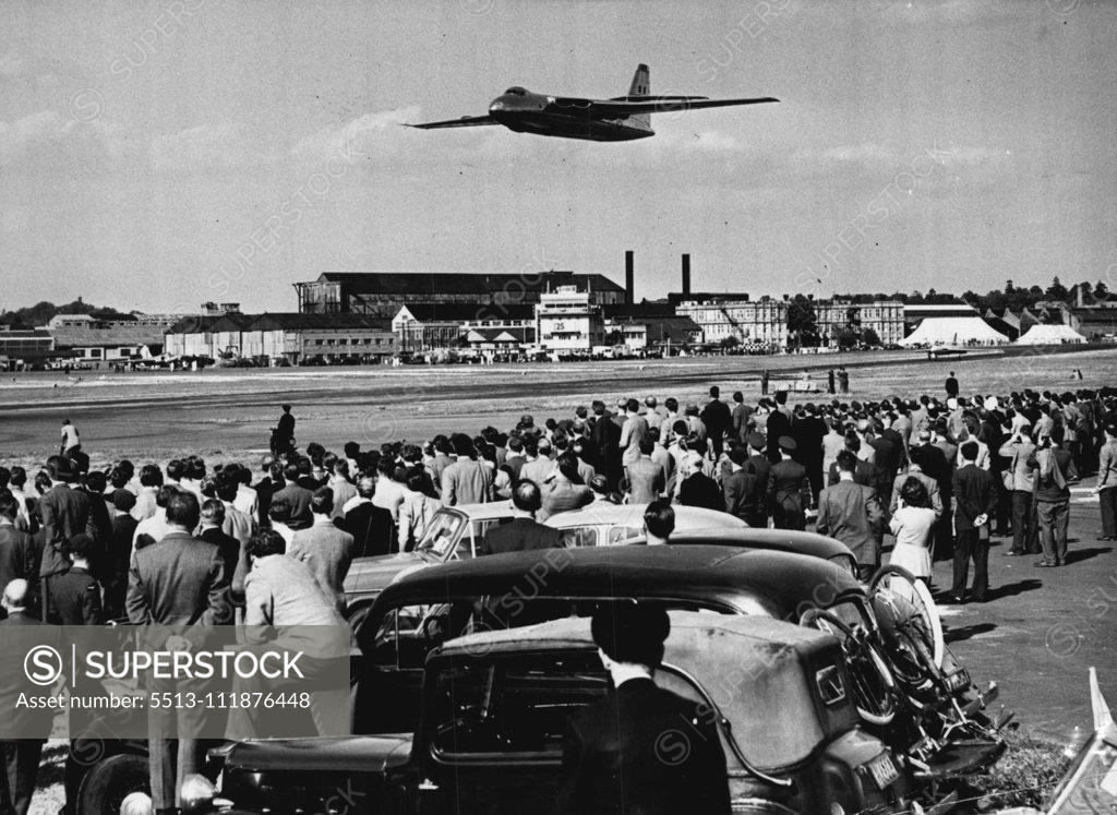 Stock Photo: 5513-111876448 The Farnborough Aircraft Display -- The Vickers Armstrong Valiant, which is powered by Four Rolls-Royce Avon turbo jet engines, seen in flight during the flying display and watched by some of the visitors to the show. Some of the world's most advanced military and civil aircraft are on view for the first time at the Society of British Aircraft Constructors's display, which opened at Farnborough, Hants., on Sept. 1st1/3. September 2, 1952. (Photo by Fox Photos). ;The Farnborough Aircraft Display 
