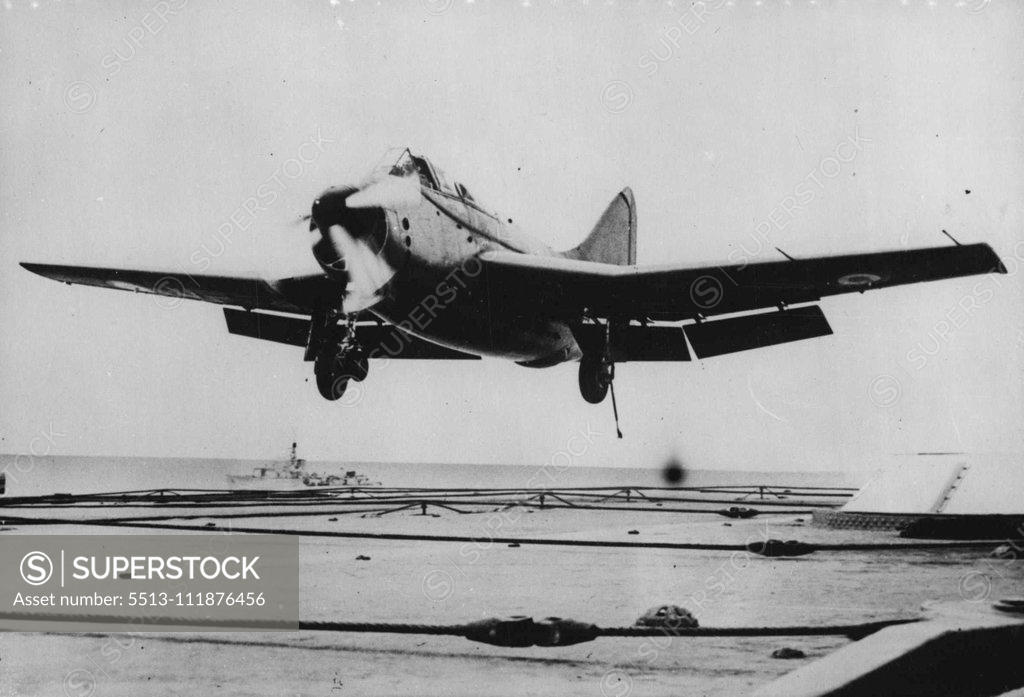 Stock Photo: 5513-111876456 Illustrious Landing -- Landing that spells success 1 or a new aircraft is this one about to be executed by lieutenant-Commander G. R. Callingham, R.N., in the new Fairey 17 antisubmarine aircraft aboard H.M.S. Illustrious. This is the first carrier landing of the Fairey 17-first prop-jet aircraft to be 'seaborne'. Power unit of the airplane is the Armstrong-Siddeley 'Double Mamba' - twin turbines driving co-axial contra-rotating propellers. Both are spinning in this picture, but one may be cut o