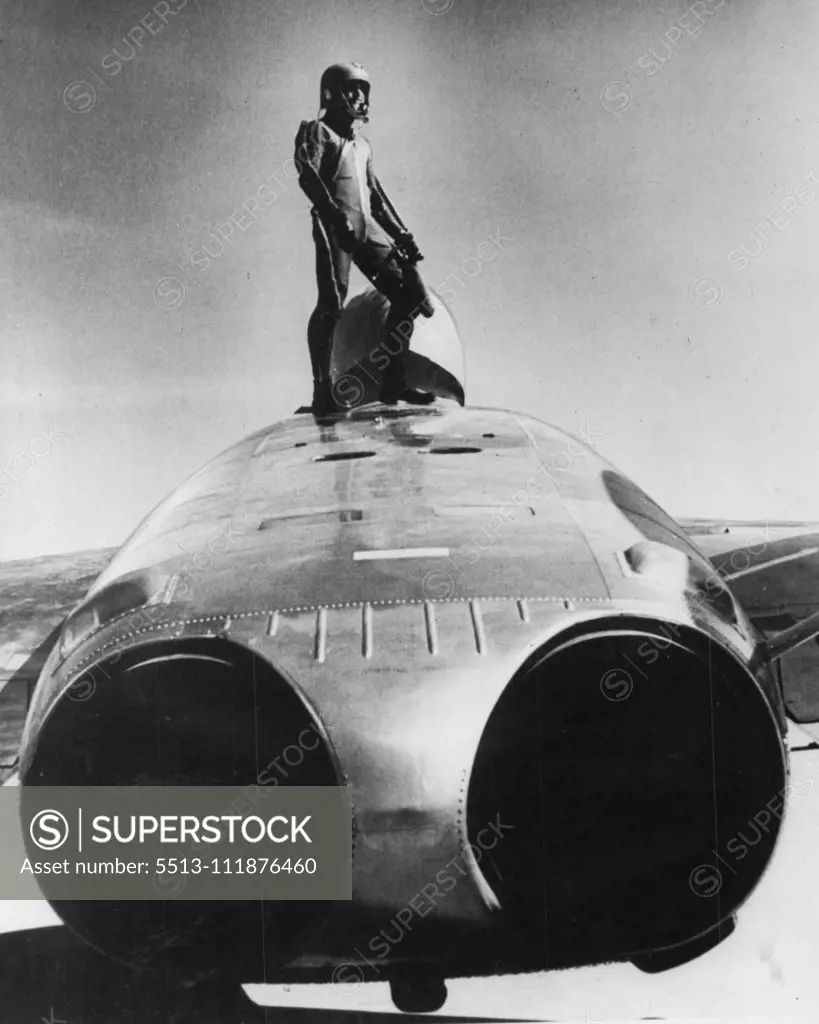 Is This A Man From Mars -- On, Just A U.S. Navy Pilot climbing out of the F7U-3 cutlass jet fighter. The cutlass is the first U.S. fighter plane to carry its rockets in an aluminium fuselage pack. After the rockets have been fired, the pack can be reloaded and used again. In the past the plasticized cardboard wing pods were jettisoned after firing. Another feature of the cutlass is that the pilot is not blinded by the rocket's flaring exhaust during night firing because of the location of the 