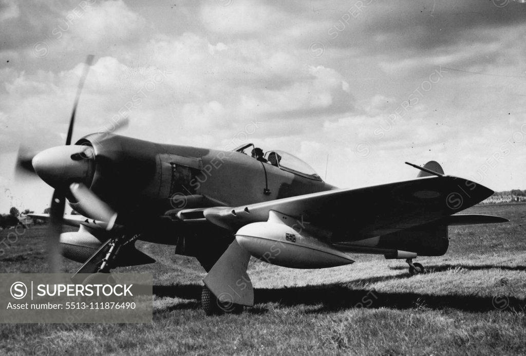 Stock Photo: 5513-111876490 Record Attempt Plane Will Make Bid Tomorrow -- Pictured leaving the Hawker Aerodrome, Langley, near Slough, to-day (Wed) is the Hawker Fury fighter which is expected to take off from is expected to take off from London Airport tomorrow in an attempt to smash the London-Rome and London-Karachi records. The pilot is 27-year-old Mr. Neville Duke, who holds the D.S.O,D.F.C and two bars, A.F.C., and Czech Military Cross. He hopes to reach Rome in about two hours, and after refueling he will take off 