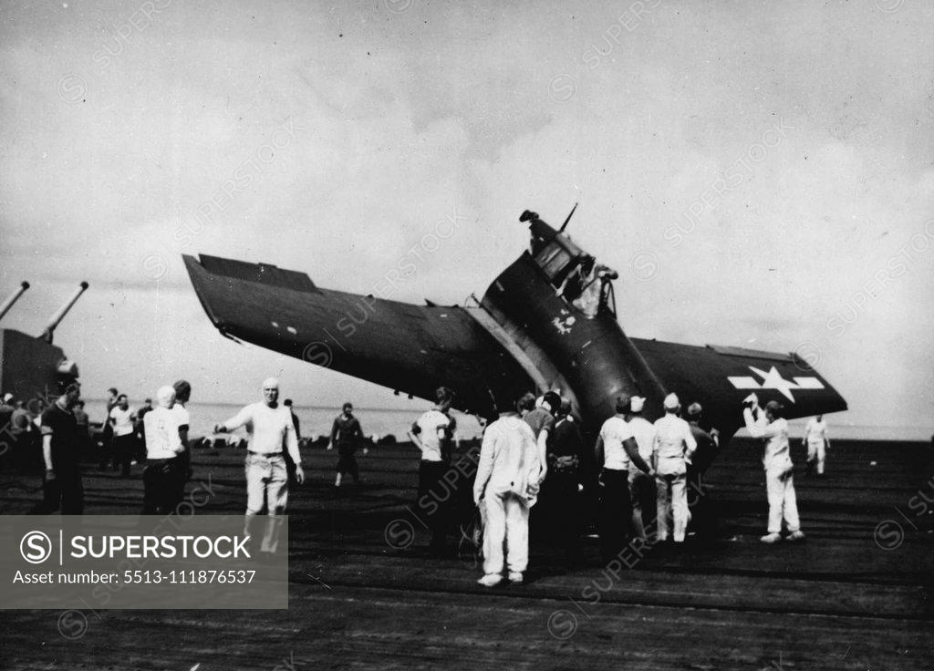 Stock Photo: 5513-111876537 Half Of U.S. Hellcat Fighter Plane Comes Safely Home To Its Carrier -- This remarkable picture of a U.S. Navy pilot climbing out of his Grumman Hellcat fighter plane after landing with "half a plane" on the ***** deck of his carrier is an unusual ***** of skill and luck. Weakened by Japanese anti-air ***** fire during a strike at Luzon, the sturdy plane ***** until the airman wobbled the cripple in ***** aboard his carrier. Planes such as this ***** among those which made attacks on Tokyo indust
