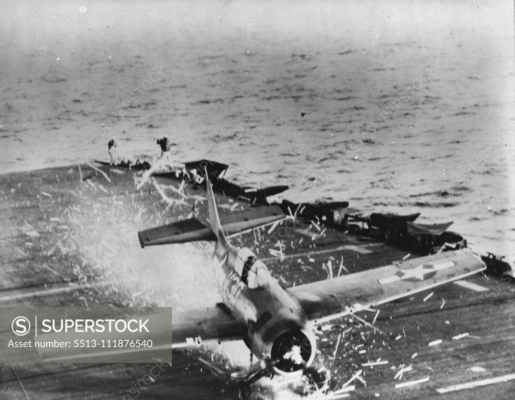 Stock Photo: 5513-111876540 Plane's Propeller ***** Carrier Deck -- A Wildcat fighter ***** propeller splinters the wooden flight deck ***** U.S. Pacific Fleet aircraft carrier, leaving ***** of kindling. The pilot was unhurt and ***** damage done to the plane and deck. August 02, 1945. (Photo by Official U.S. Navy Photo).;Plane's Propeller ***** Carrier Deck -- A Wildcat fighter ***** propeller splinters the wooden flight deck ***** U.S. Pacific Fleet aircraft carrier, leaving ***** of kindling. The pilot was unhurt and *