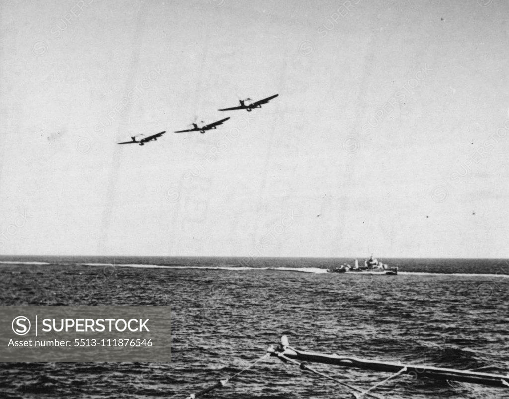 Stock Photo: 5513-111876546 Army Fighters Take To The Air At Sea -- United States Army fighter squadrons assemble in the air after their take-off from A Navy carrier that has transported them to a war zone. As the planes roar back over ***** carrier, large placards on the ***** pilots the proper course ***** to their destination. The carrier ***** to within flying range of the ***** delivery and eliminating ***** of unpacking crated planes and reassembling them in the fighting zone. March 31, 1943. (Photo by Associated Pre