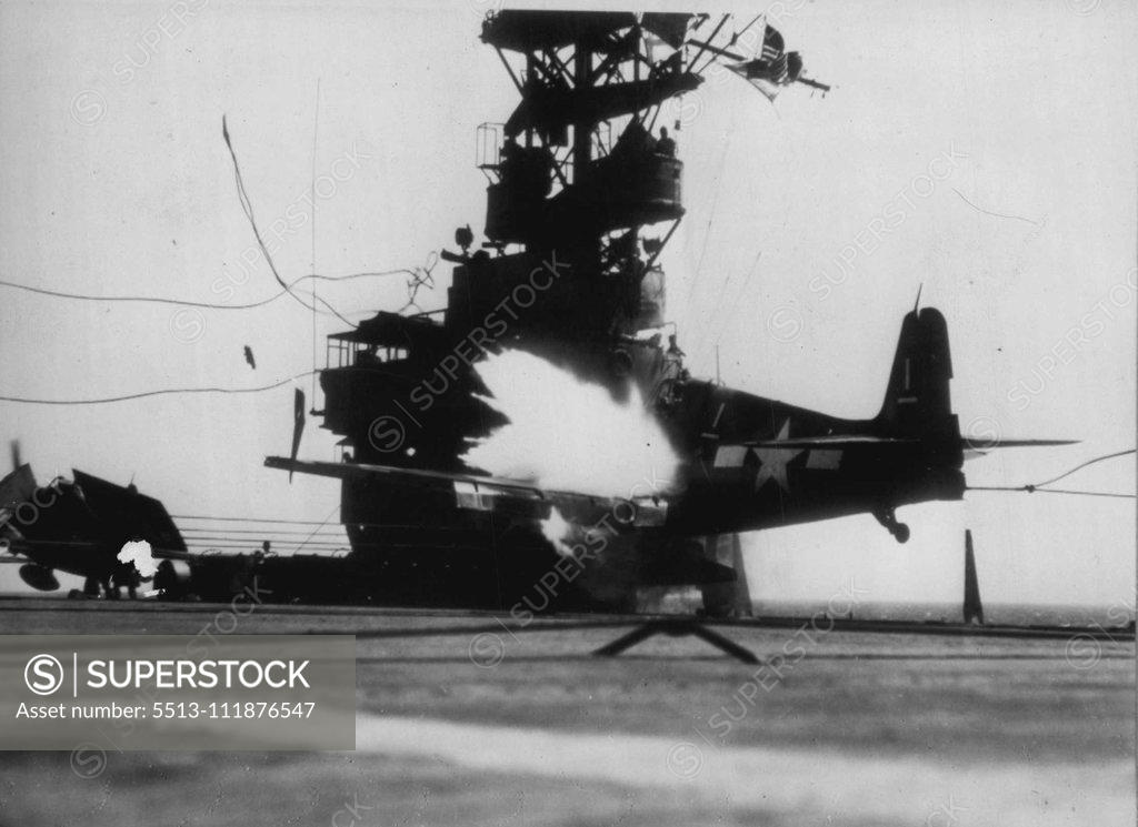Stock Photo: 5513-111876547 Carrier Plane Explodes In Landing Mishap -- Flames burst forth from exploding gasoline tank in a Navy Hellcat plane as it speeds across deck of a carrier in the Pacific in a landing mishap. Plane missed arresting cable and crashed into island at side of deck. Navy caption states that pilot, Lt. (JG) William G. Bailey of Wilson. S.C., was *****. June 18, 1945. (Photo by AP Wirephoto). ;Carrier Plane Explodes In Landing Mi-Shap -- Flames burst forth from exploding gasoline tank in a Navy Hellcat p