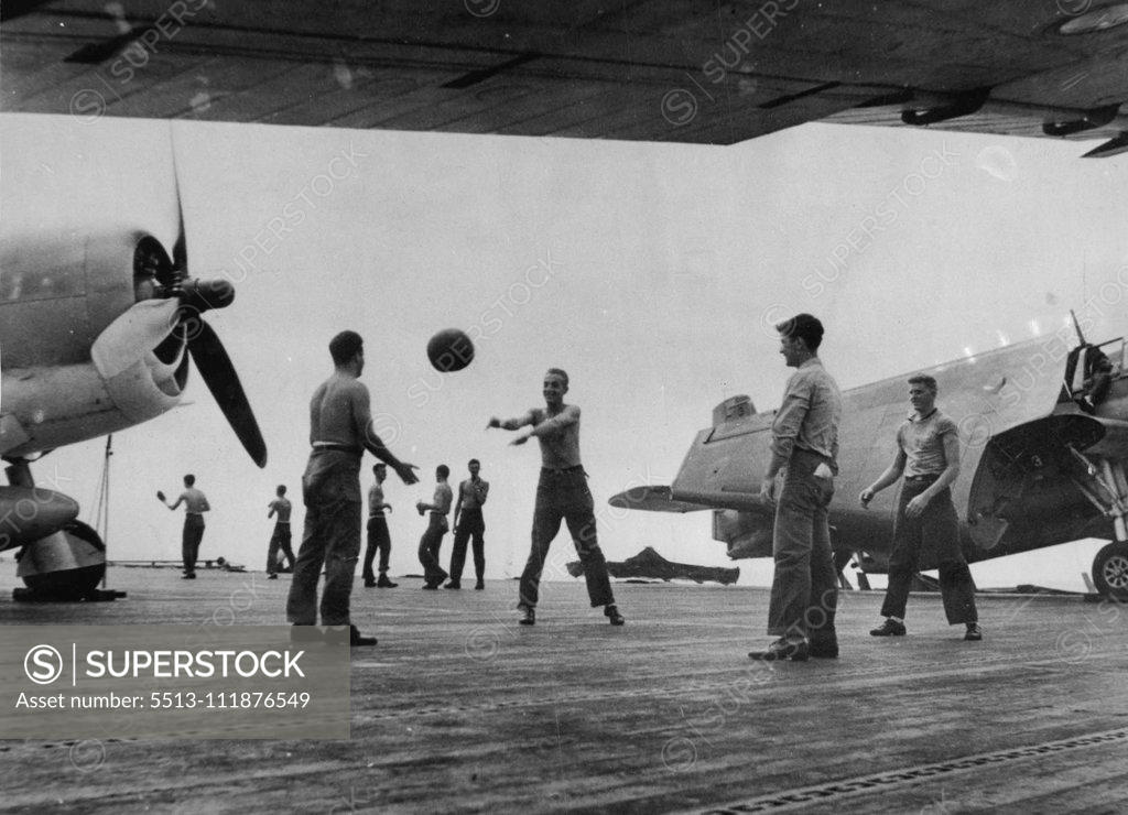 Stock Photo: 5513-111876549 A game ball aboard a United States Navy aircraft carrier in Central Pacific operations, against Japanese strongholds. March 14, 1944. (Photo by Official U.S. Navy Photograph).;A game ball aboard a United States Navy aircraft carrier in Central Pacific operations, against Japanese strongholds.