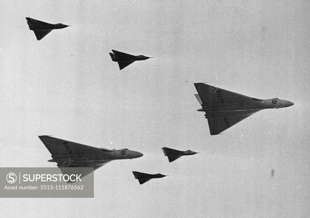 Stock Photo: 5513-111876562 Flying Display And Exhibition On Opens Today At Farborough Hants -- The air striking force of the future, Delta wing aircraft manufactured by the A.V. Roe Company seen in flight over Farnborough, The leading Vulcan is powered by Olympus Jet engine, the second by Armstrong-Siddley Sapphire Jets. The four delta-wing research aircraft are A.V. Roe type 707 A. (two) 707 B. and 707 C. Large crowds today attended the 1953 Flying Display and Exhibition, showing the products of members of the Society of