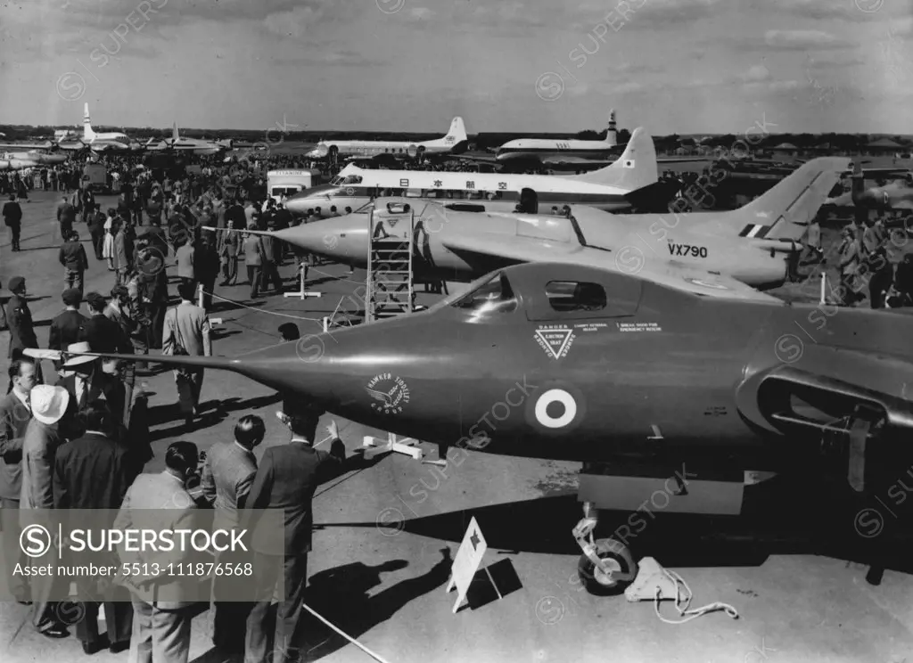 "Planes With A Bite" - At The Air Show -- In the right background is a British Overseas Airways Corporation "Comet" - the world's first jet airliner. Aircraft that 'pack & punch' are on show at the society of British Aircraft Constructors' exhibition here. In the foreground is the Avro Type 707A, a delta-wing research aircraft, powered by one Rolls-Royce Derwent Turbo jet engine. September 1, 1952. (Photo by Planet News Ltd.).;"Planes With A Bite" - At The Air Show -- In the right background is 