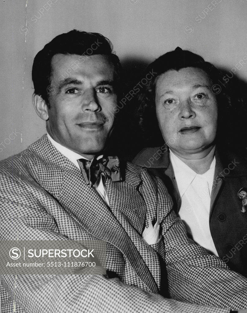 Stock Photo: 5513-111876700 Frank Parker, one of Donald Budge's touring professionals, photographed with his wife ***** after arrival in Sydney. December 12, 1951. ;Frank Parker, one of Donald Budge's touring professionals, photographed with his wife ***** after arrival in Sydney.