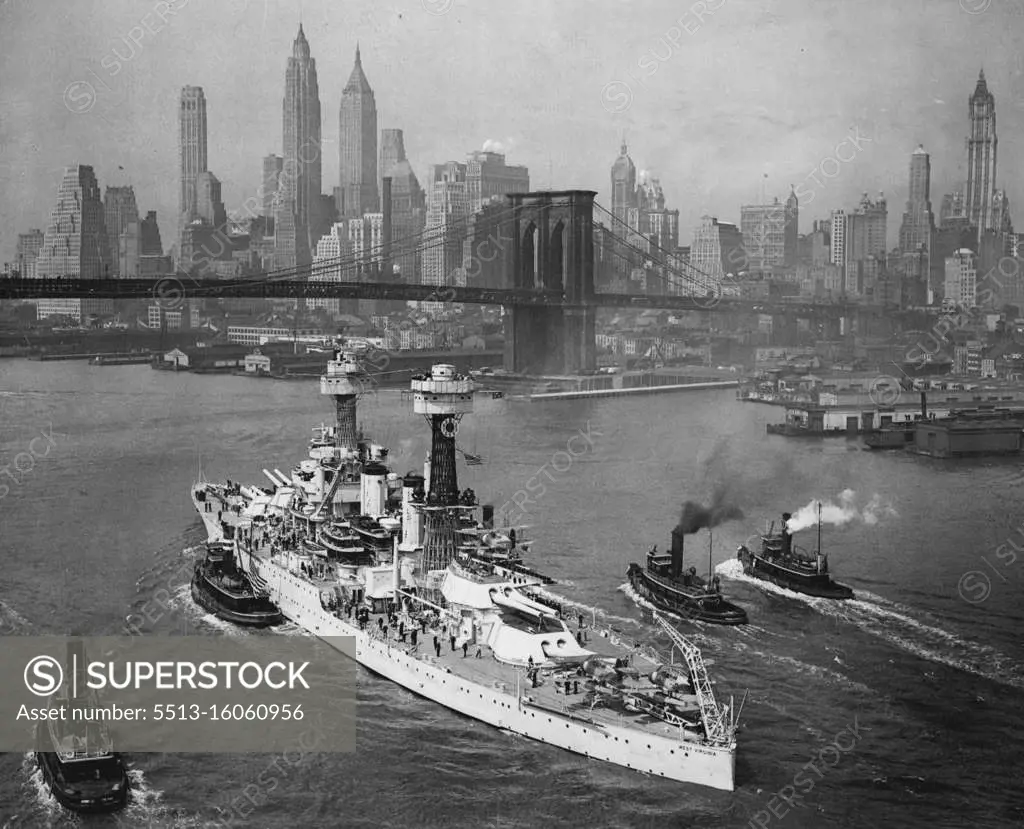 New York ..... An impressive shot of the U.S.S. West Virginia, one of uncle Sam's most potent battle wagons. As She steamed majestically down the east river under the Brooklyn bridge today at the start of her long voyage back to the Pacific. The imposing skyline of Manhattan in background forms a striking setting for the ship as she says goodbye to the home of father Knickerbocker where she had been scheduled to play an important role in world's fair celebrations until ordered back to the west coast with other ships of the fleet. June 06, 1939. (Photo by International News Photo).