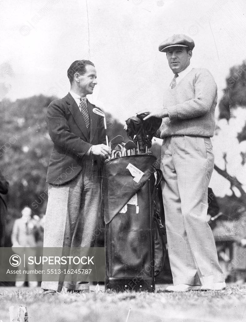 Stock Photo: 5513-16245787 Henry Cooper, the American professional golfer, has a big task of selecting which club to use from his huge outfit, but it is nothing to the task of the caddy who has to carry it. November 19, 1934.