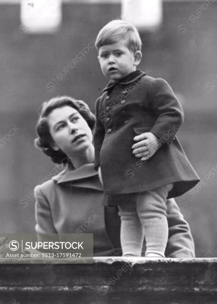 The Princess Watches As Queen Juliana Visits The City -- Warmly wrapped little Prince Charles and Princess Elizabeth watch the procession from the wall of Clarence House for the Princess it was a unique experience to be a spectator. Queen Juliana and the Prince of the Netherlands today drove in state to The Guildhall to lunch with the Lord Mayor and the Corporation of London. Princess Elizabeth watched procession from Clarence House. November 22, 1950. (Photo by Fox Photos).