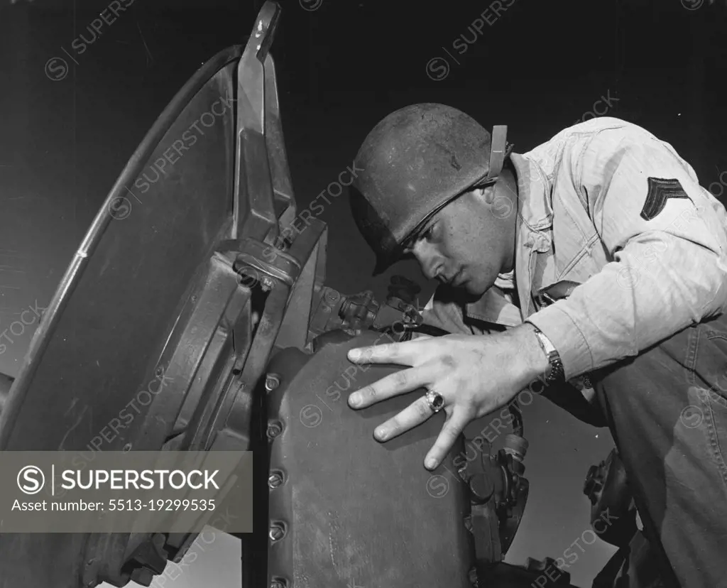 Look To The Skies -- Cpl. Don Hackney, Lamesa, Texas, aligns the optical axis with the electrical axis as he collimates the radar de-vice on the sky sweeper. Cpl. Hackney is assigned to battery a, 531st anti aircraft artillery battalion, Fort Bliss, Texas. December 02, 1954. (Photo by Official U.S. Army Photo).