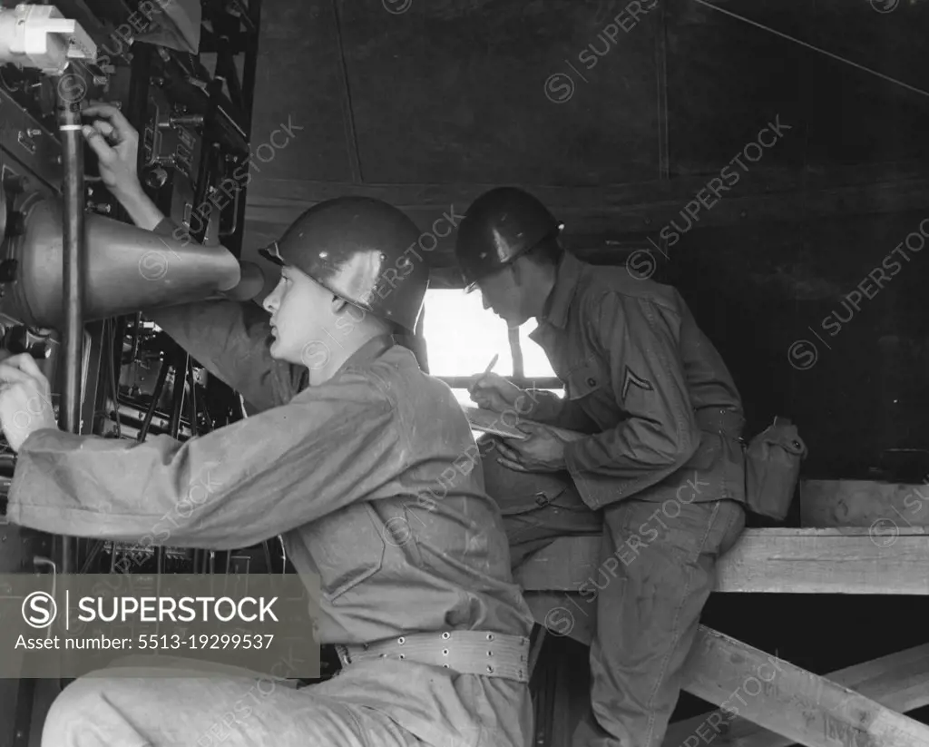 Look To The Skies -- Pvt. Donald R. Carver, Topeka, Kansas, is checking target ranges on the plan position indicator scope of the radar installation while Pfc. Marvin G. Bergmann Logs operations. Both men are members of battery B, 531st anti aircraft artillery battalion, Fort Bliss, Texas. December 06, 1954. (Photo by Official U.S. Army Photo).