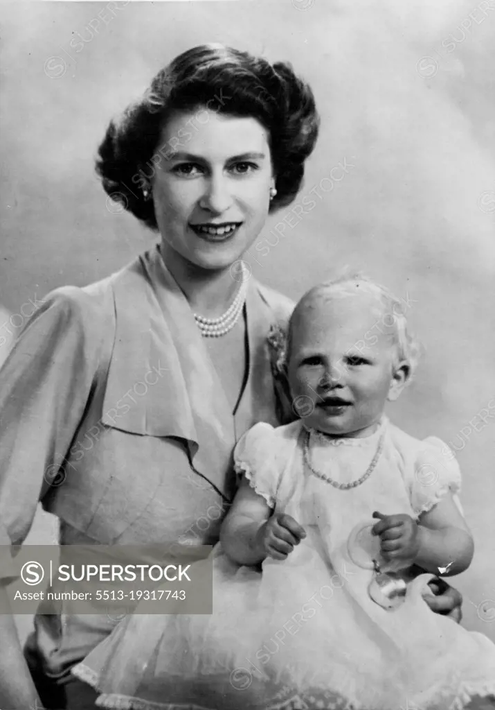 Birthday Picture Of Princess Anne -- A new and charming study of Princess Elizabeth with her baby daughter taken on the occasion of Princess Anne's first birthday, August 15th, 1951. The baby Princess is wearing the coral necklace and holding the rattle used by princess Elizabeth when she was photo graphed at the same age, in 1927. August 15, 1951. (Photo by Fox Photos).
