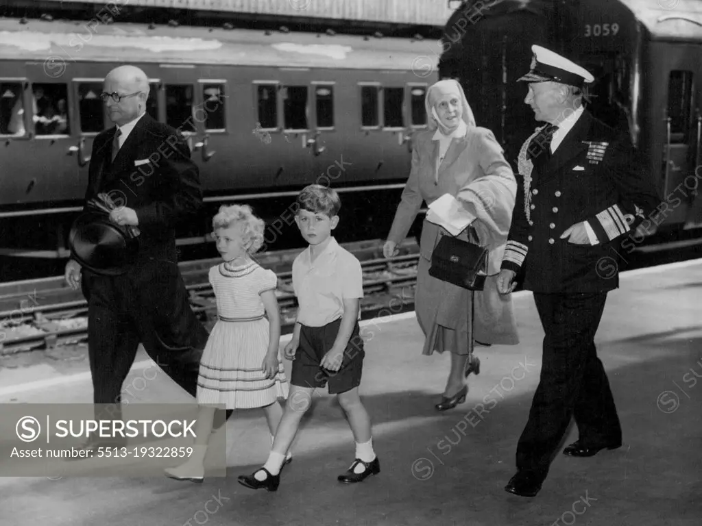 Royal Children Arrive At Portsmouth -- Prince Charles and his sister, Prince Anne, followed by their grandmother, Princess Andrew of Greece, and accompanied by Vice-Admiral Conolly Abel Smith, Flag officer Royal Yachts, and Stationmaster Mr. T. Fryer, walk from the train on arrival at Portsmouth to-day (Friday) from London to embark in the Royal yacht Britannia.They are to join their parents, the Queen and Duke of Edinburgh, on an eight-day cruise, during which the Royal couple will fulfill engagements in Wales, the Isle of Man, and Scotland. August 05, 1955.