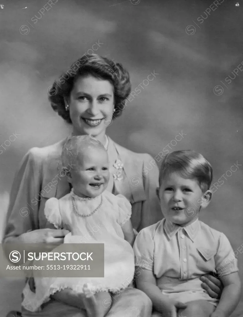 A charming study of Queen Elizabeth with Princess Anne and Prince Charles. December 14, 1953. (Photo by Marcus Adams, The London Electrotype Agency Ltd.).