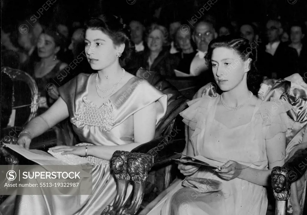 Princesses See Students Perform 'Iolanthe' -- Princess Elizabeth (left) and Princess Margaret as they watched the performance.Princess Elizabeth and Princess Margaret, daughters of King George and Queen Elizabeth, attended a performance of the Gilbert and Sullivan light opera 'Iolanthe'  given by students at the Guildhall School of Music and Drama, London. November 28, 1946.