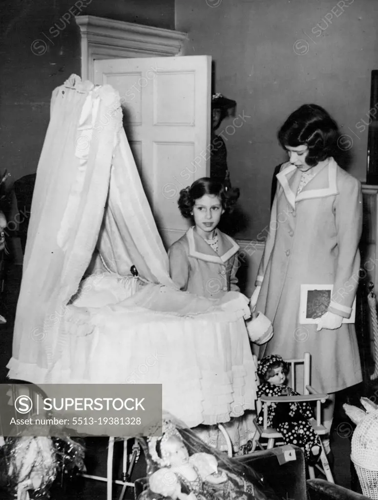 Princesses View Their Own Cot At Exhibition -- Princess Elizabeth (right ***** Princess Margaret Rose viewing the ***** both used as babies and which is now ***** was formerly their nursery.Princess Elizabeth and Princess Margaret Rose visited their old home. No.145, Piccadilly, London residence of the King and Queen when Duke and Duchess of York, to view the Exhibition of Royal and Historic Treasures, to which they, with other members of the Royal Family have contributed exhibits. The Queen recently visited the Exhibition with the King and was so impressed that she decided that the Princesses should go, too. July 28, 1939.