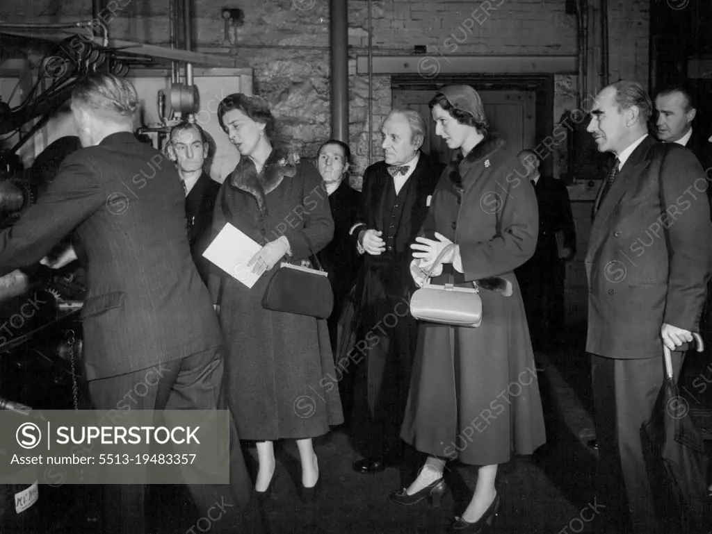 First Official Tour For Prince's Alexandra - 16 year old Princess Alexandra of Kent went on her first official tour yesterday a trip to Lancashire's cotton belt. Her mother, the Duchess of Kent went with her. The Duchess and her daughter stop to look at machinery at the Calico Printing works at Accrington. October 13, 1953. (Photo by Daily Express Picture).