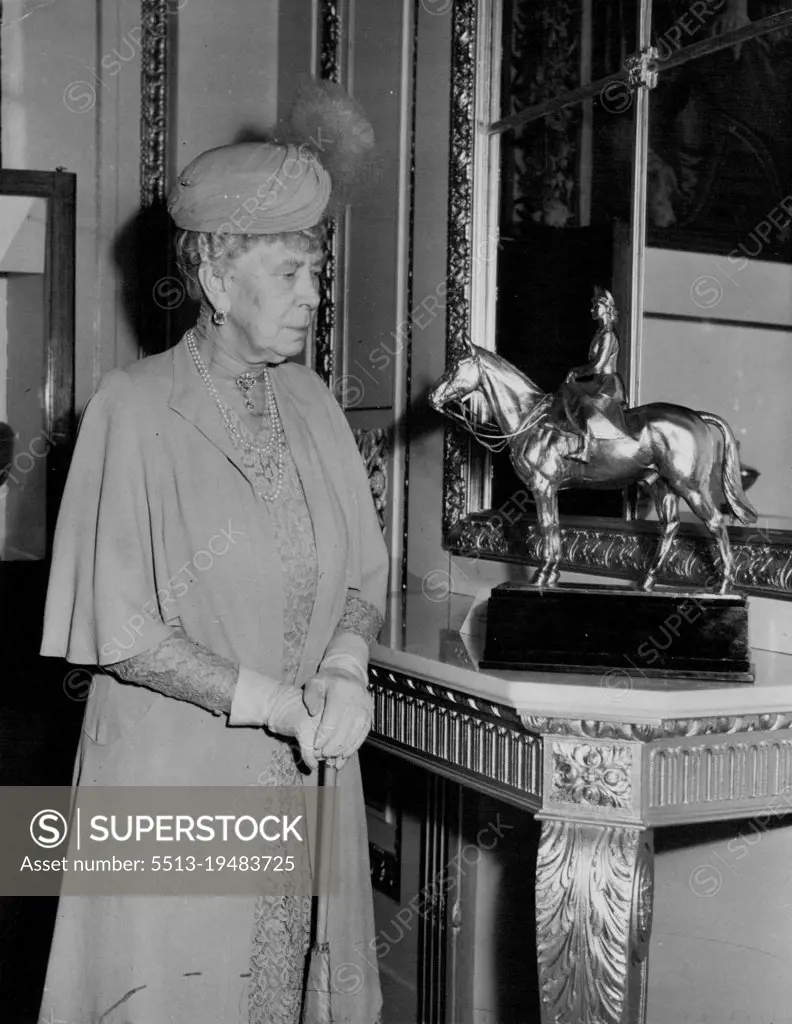 Queen Mary Sees The Princess Elizabeth Statuette -- When Queen Mary saw this silver-gilt equestrian statue the today (Monday) she said; There is my grand daughter she was at the Festival Exhibition of Modern British Silverwork in the Goldsmiths Hall, Foster Lane, London, to which she has loaned pieces of silverwork. The statuette, of Princess Elizabeth dressed as a Colonel of the Grenadier Guarde, was loaned from Buckingham Palace by the King and Queen. It was designed and made in 1948 by Doris Linder. July 09, 1951. (Photo by Reuterphoto).
