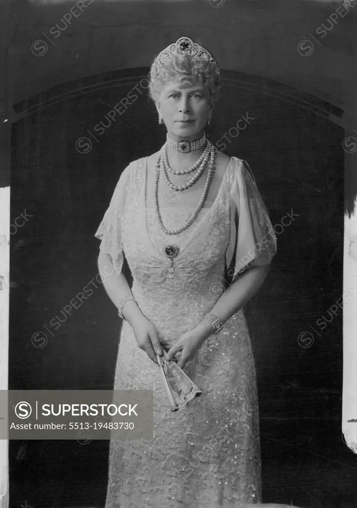 Queen Mary - 69 To-Day -- Recent Photograph of Queen Mary, who is 69 to-day. She is shown in one her favorite lace dresses - Ivory lace over an ice-blue satin slip, with an ice-blue satin bow from the shoulder. May 25, 1936. (Photo by Hay Wrightson).